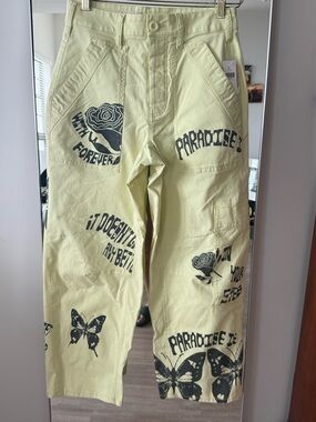 Anthropology Pale Yellow Women's cargo Jeans with Graphics and Button Accent